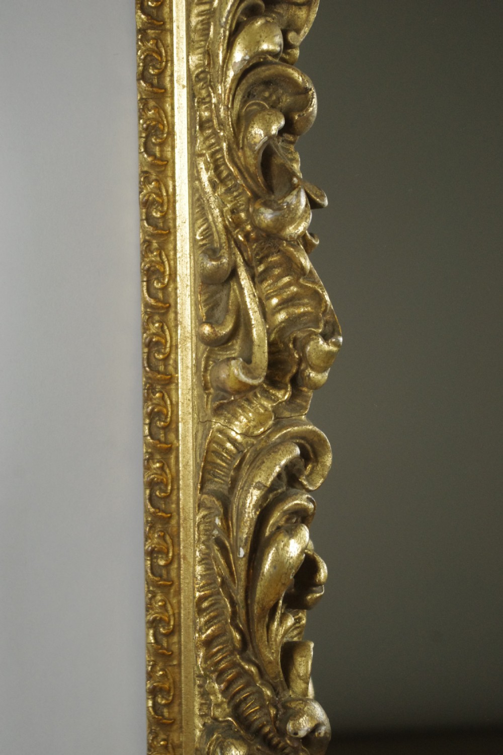 A rectangular Victorian wall mirror featuring an ornate gold giltwood frame with detailed scrollwork moulding. View XII