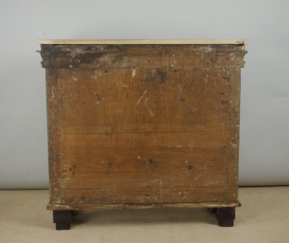A 19th-century French console table with a cream marble top, green painted base, gilding, and large scroll legs. View XIX