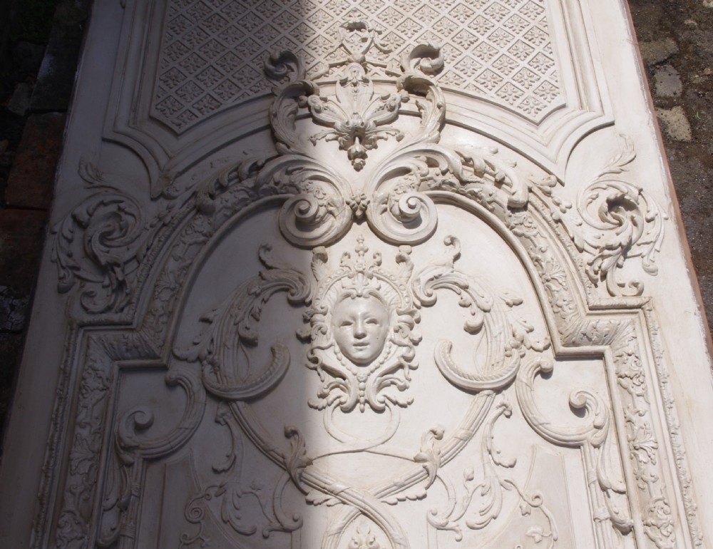 A pair of tall 19th-century French painted wood boiserie wall panels featuring intricate Rococo carved mouldings and foliage motifs in an off-white finish. View IX