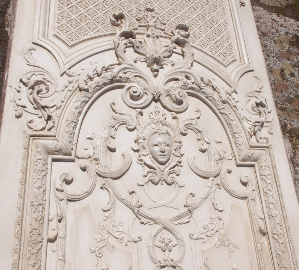 A pair of tall 19th-century French painted wood boiserie wall panels featuring intricate Rococo carved mouldings and foliage motifs in an off-white finish. View XIV