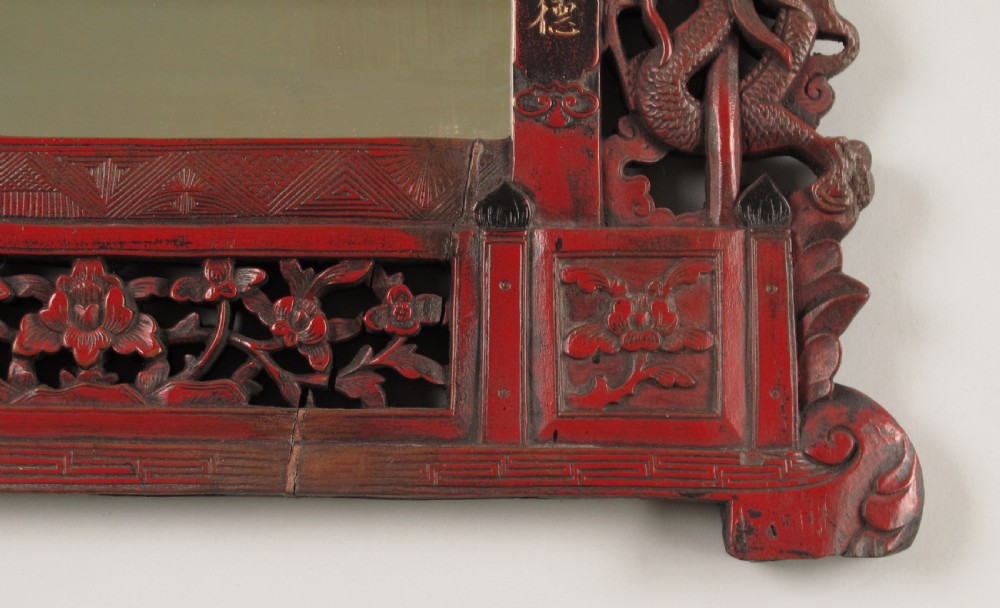 A 19th-century Chinese red lacquer wall mirror featuring a carved pagoda top, dragon side columns, and calligraphic text. View VIII