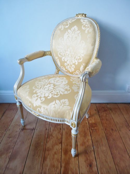 A Cream & Gilded Arm Chair