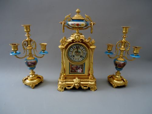 A Ormolu Clock Set with Sevres Style Porcelain Panels