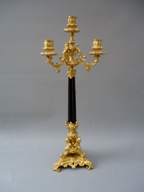 A High Quality Antique French Ormolu and Ebony Candle Stick