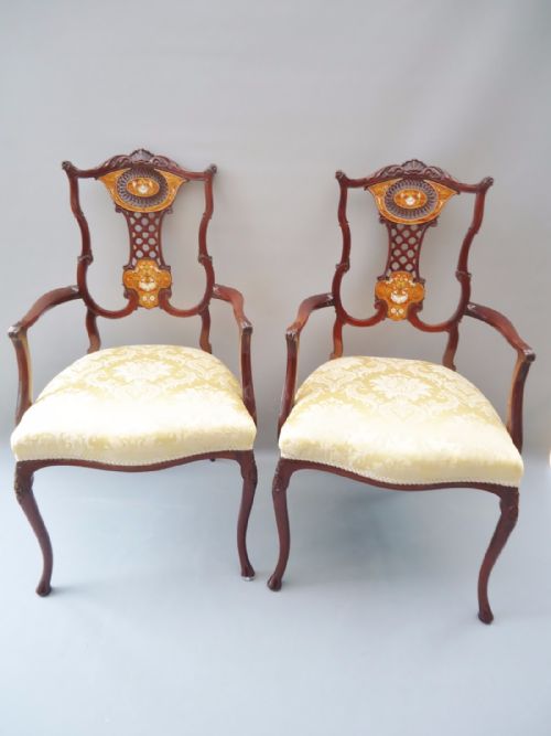 An Extremely Fine Pair of Inlaid Arm Chairs