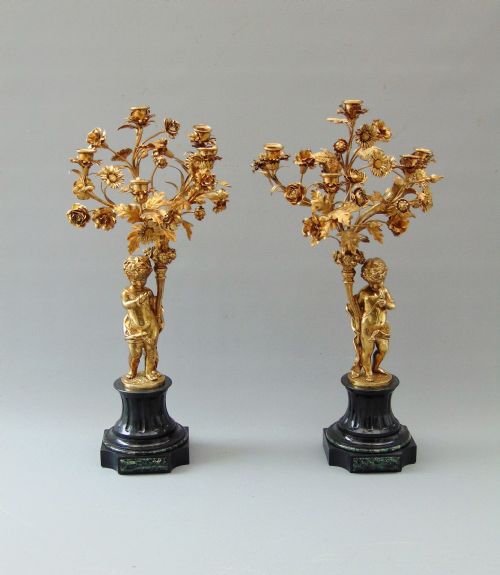 A Fabulous Pair of Cherub Ormolu Candelabra Candlesticks
