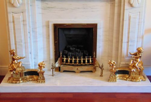 A Stunning Pair of Cherub Chenet Fire Guards
