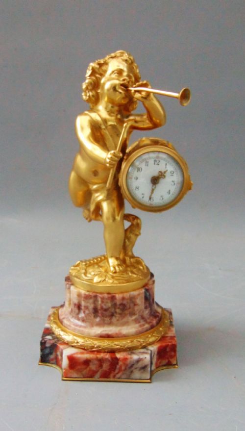 A Fine Ormolu Cherub Clock