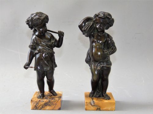 A Pair of Bronze Cherubs