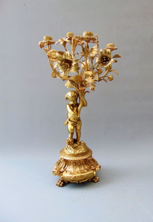 A Ormolu Cherub Candlestick