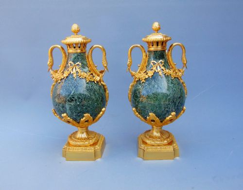 A Fine Pair of Marble Cassolettes
