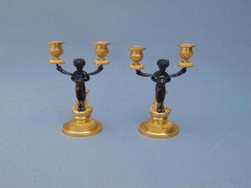 A Pretty Pair of Cherub Candlesticks
