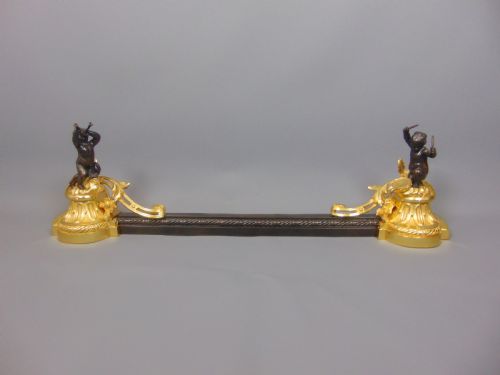 A Gilt and Bronze Cherub Chenet Fender