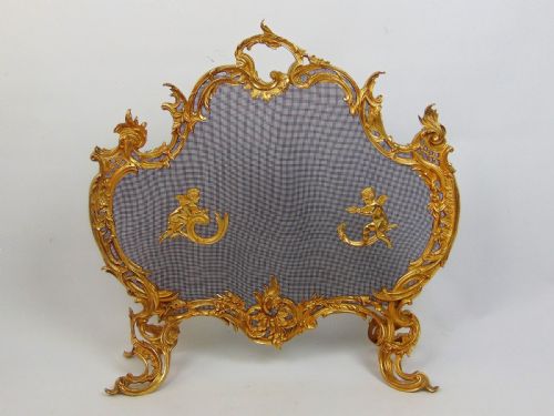 A Superb Gilt Cherub Fire Screen