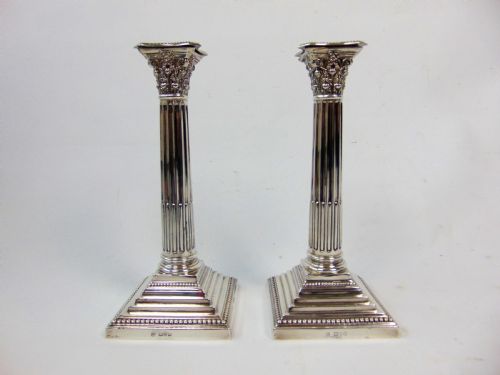 A Fine Pair Pair of Silver Candlesticks by Barker Bros