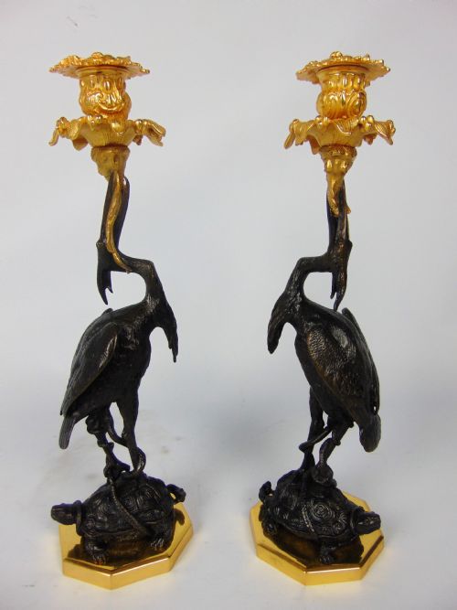 A Quality Pair of Bronze Crane Candlesticks