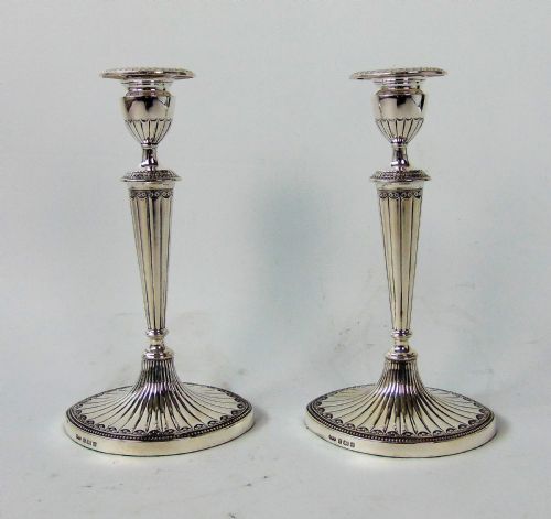 A Fine Pair of Elkington Silver Candlesticks