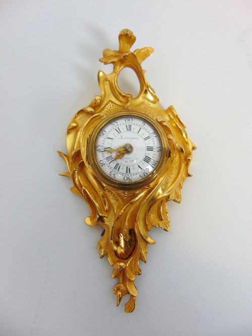 A Gilt Bronze Cartel Clock