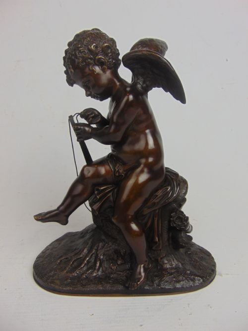 A Bronze Cupid Stringing His Bow