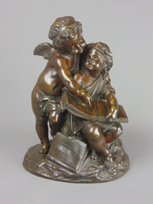 A Fine Bronze of a Cherub and Girl