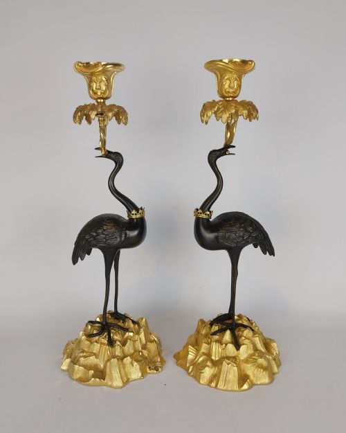A Pair of Gilt and Bronze Stork Candlesticks