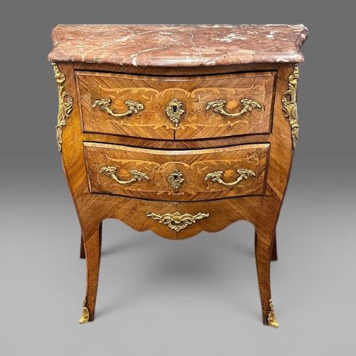 A French Louis XV style bombe commode featuring floral marquetry inlays, gilt bronze mounts, two drawers, cabriole legs, and a red marble top. View III
