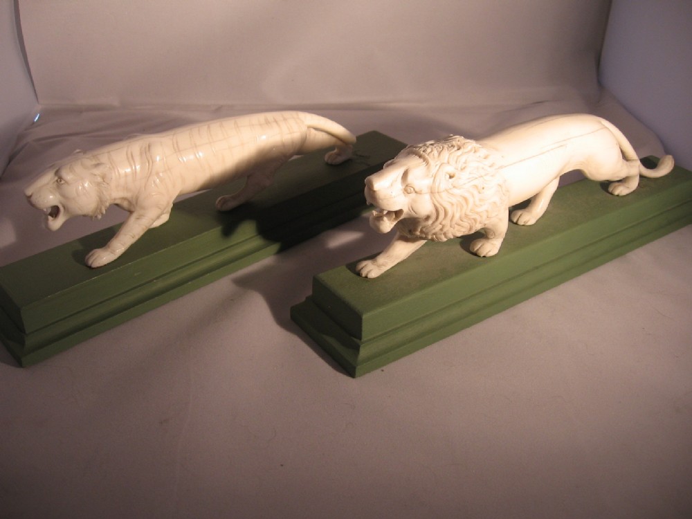 Pair of lion ivory subjects
