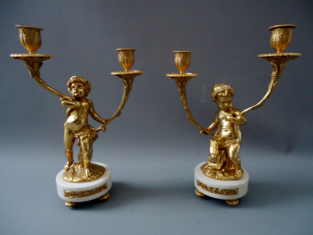 A high quality pair of Louis XV style ormolu candlesticks 