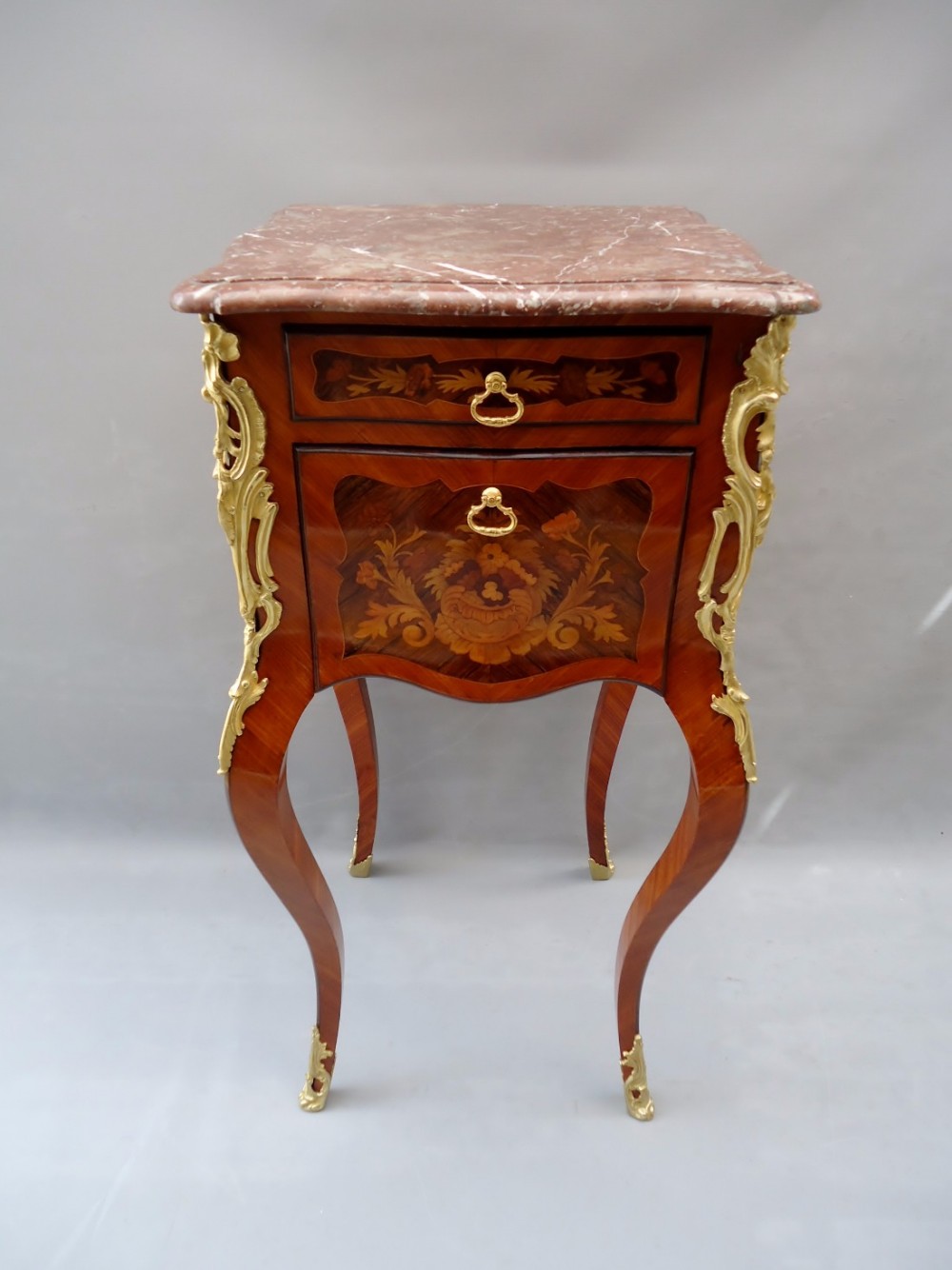 A french Loius XV bombe shaped side cabinet