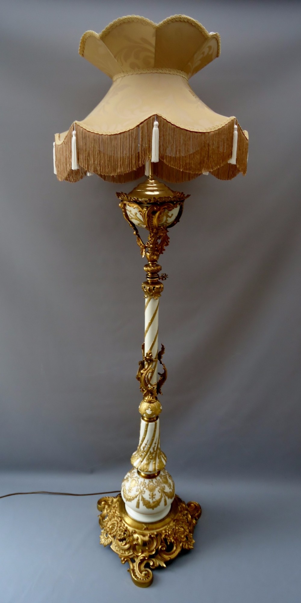 A superb porcelain and gilt standard lamp
