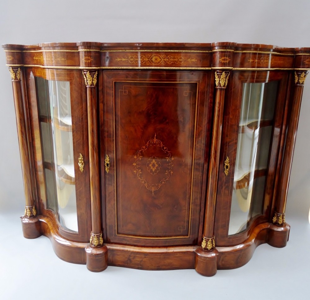 A stunning burr walnut serpentine shape credenza cabinet 