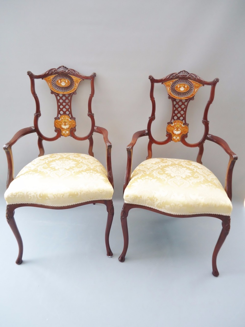 an extremely fine pair of inlaid arm chairs 