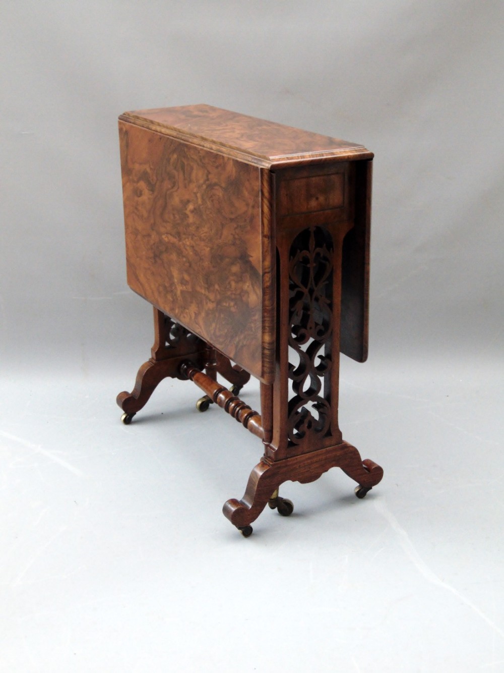 A burr walnut petite sutherland table 