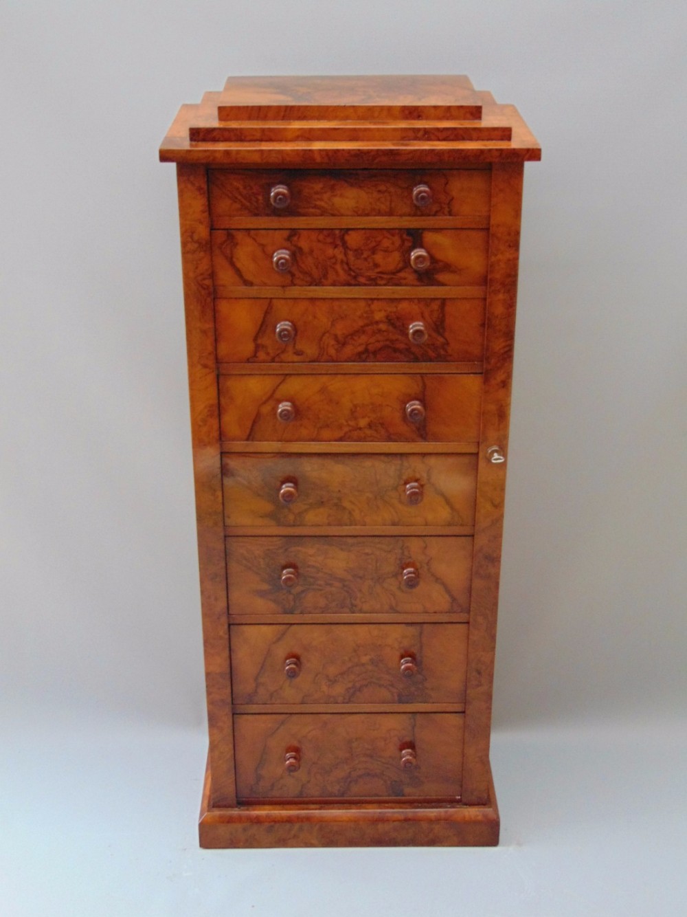 A Victorian Walnut Wellington Chest of Drawers