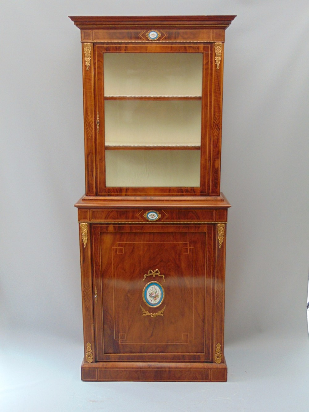 A  good walnut bookcase display cabinet