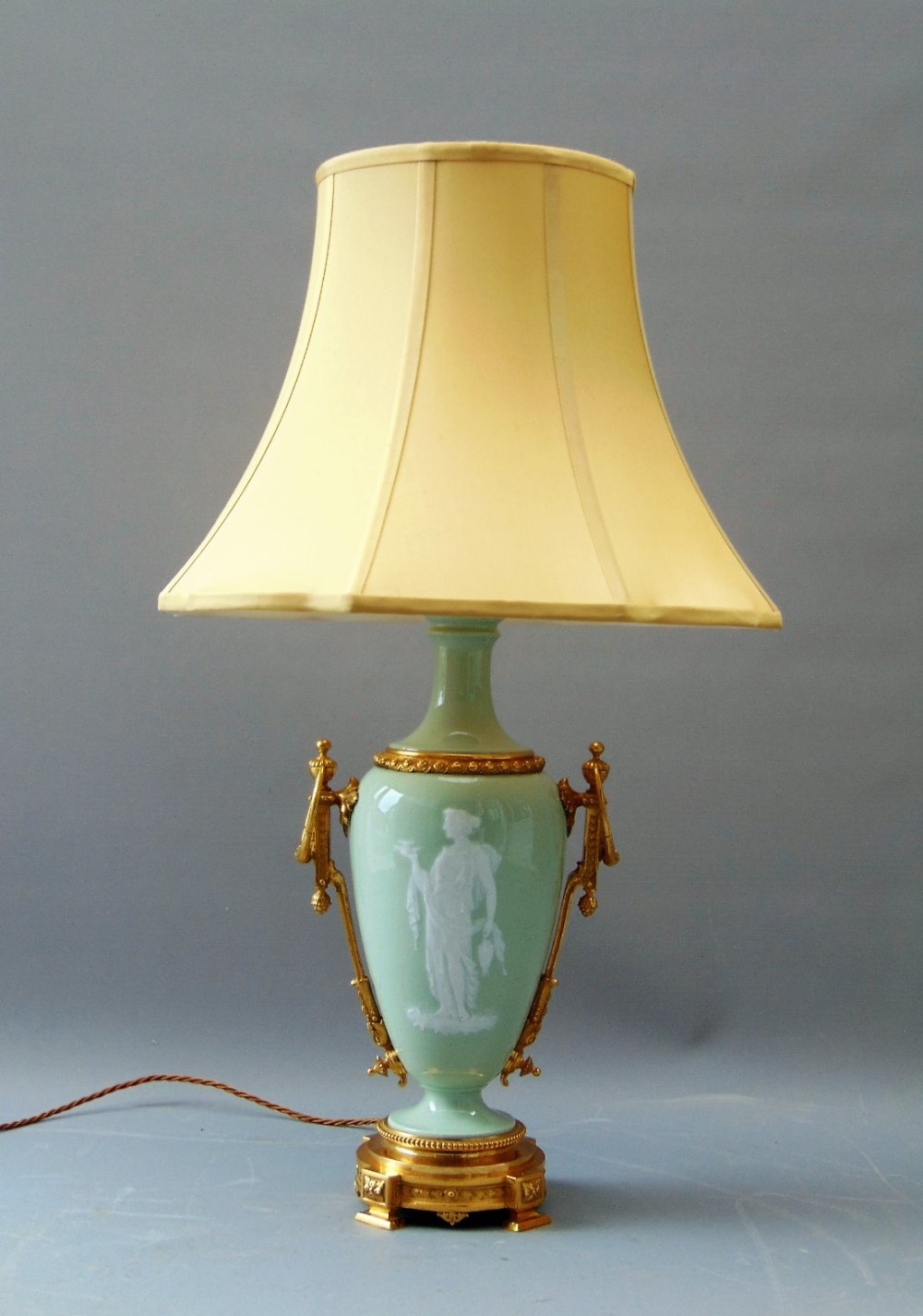 A porcelain pate sur pate antique table lamp