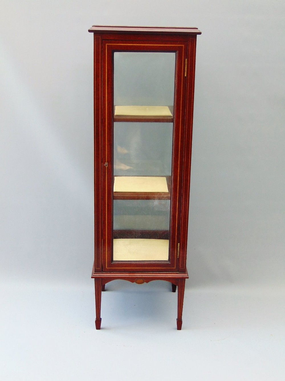 A slim Mahogany Bijouterie Display Cabinet 