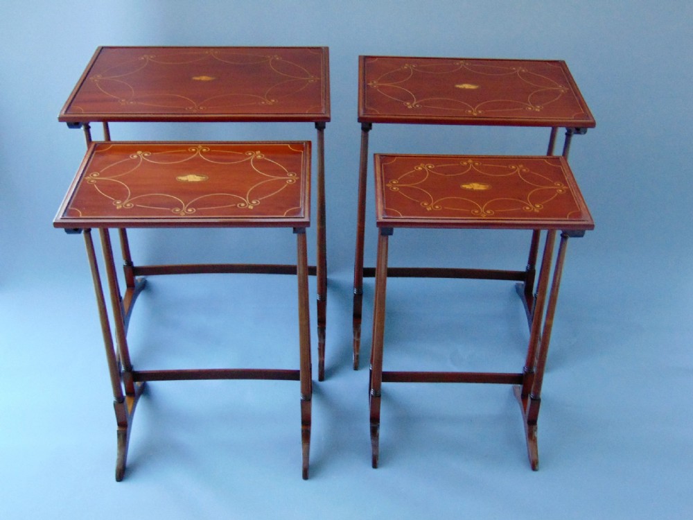 A fabulous nest of four mahogany tables quartetto View III