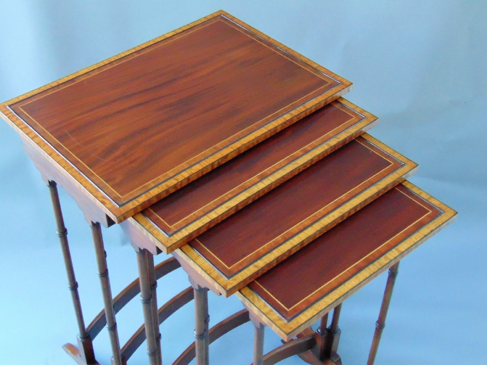 A quality  nest of four mahogany tables quartteto