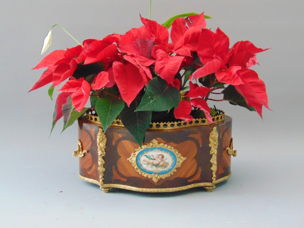A pretty Tulip wood Table Planter jardiniere