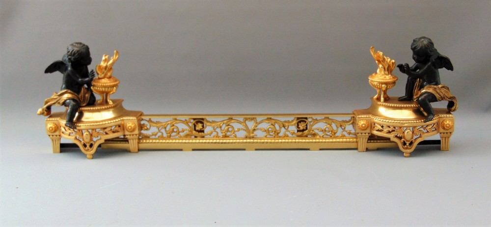 A Ormolu and Bronze  cherub chenet andiron 