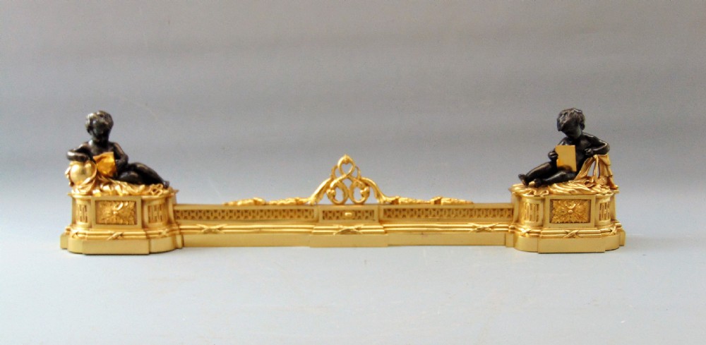 A  wonderful Pair of Ormolu and Bronze Chenets Fender 