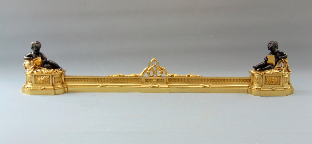 A  wonderful Pair of Ormolu and Bronze Chenets Fender  View VI