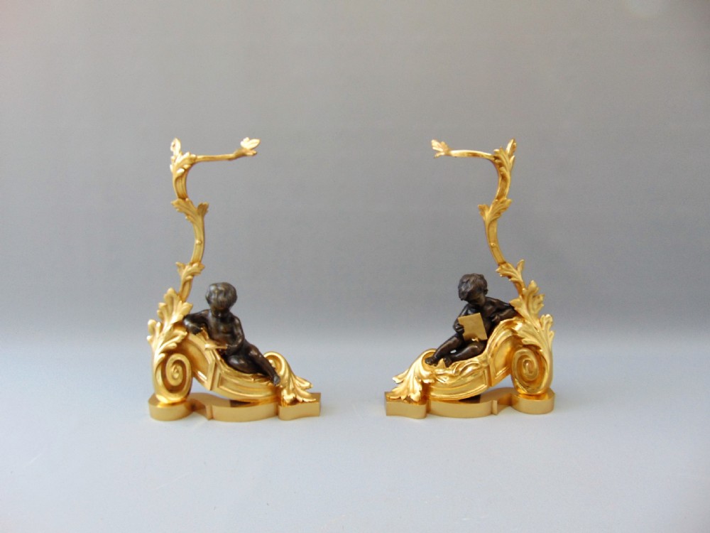 A fine Pair of Ormolu and Bronze fire side Chenet Andirons 