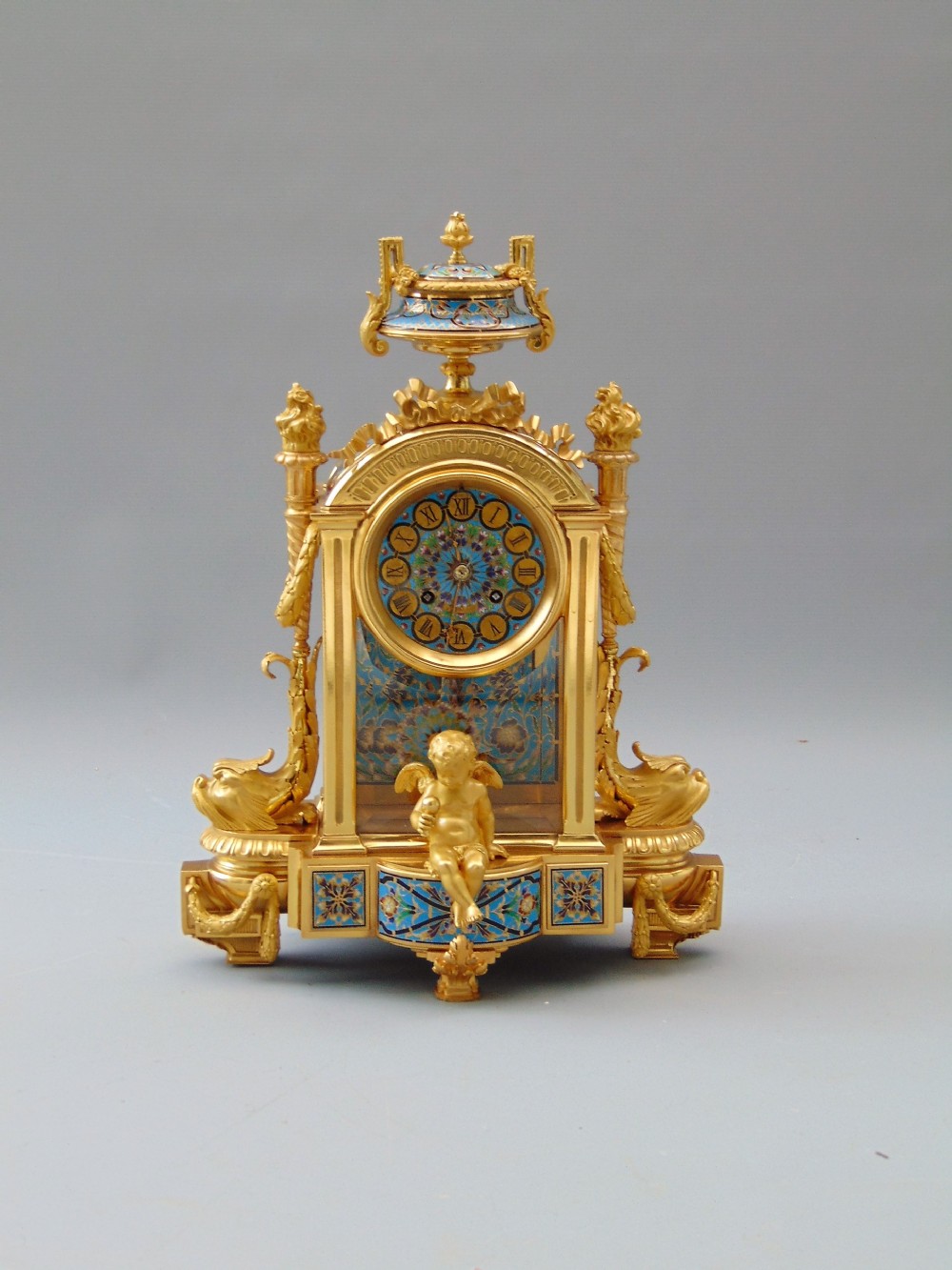 A fine ormolu and champlevé clockwith 