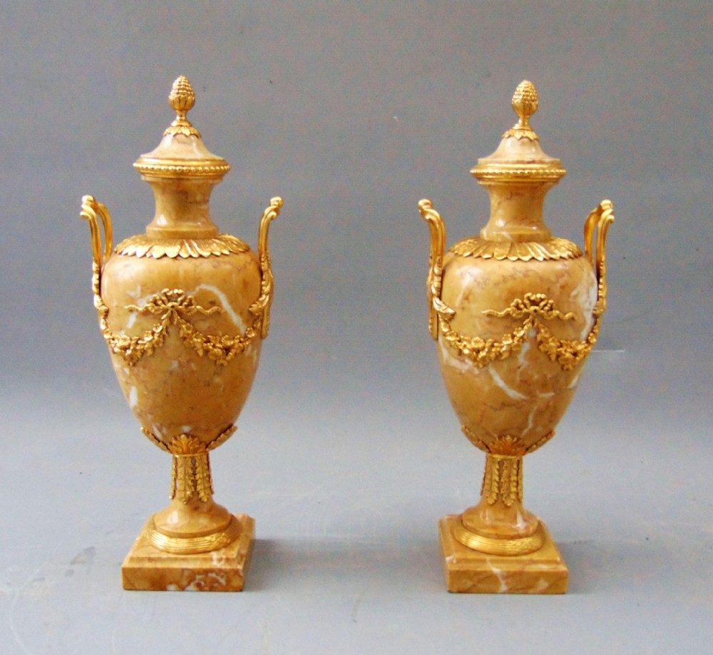 A elegant Pair of Sienna Marble Cassolettes 