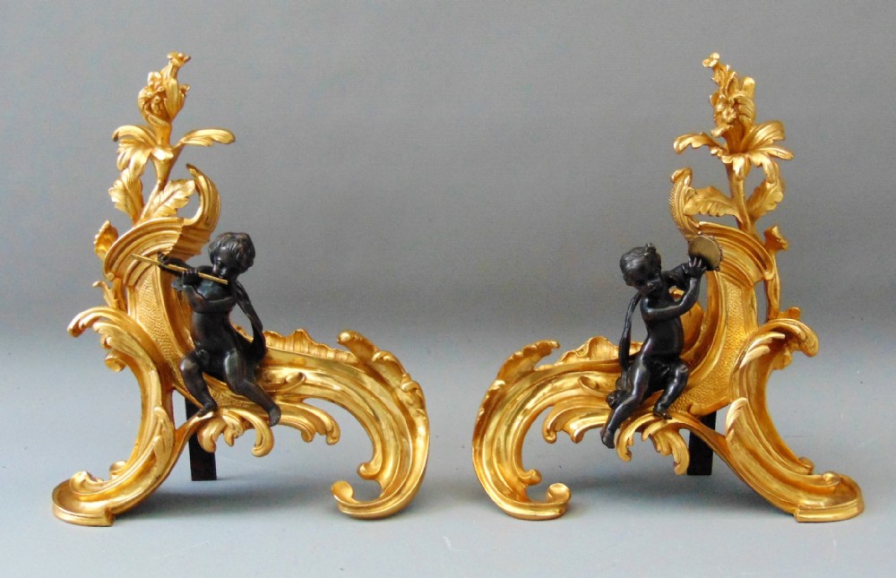 A Pair of Ormolu Cherub Chenets Andirons Fire irons 