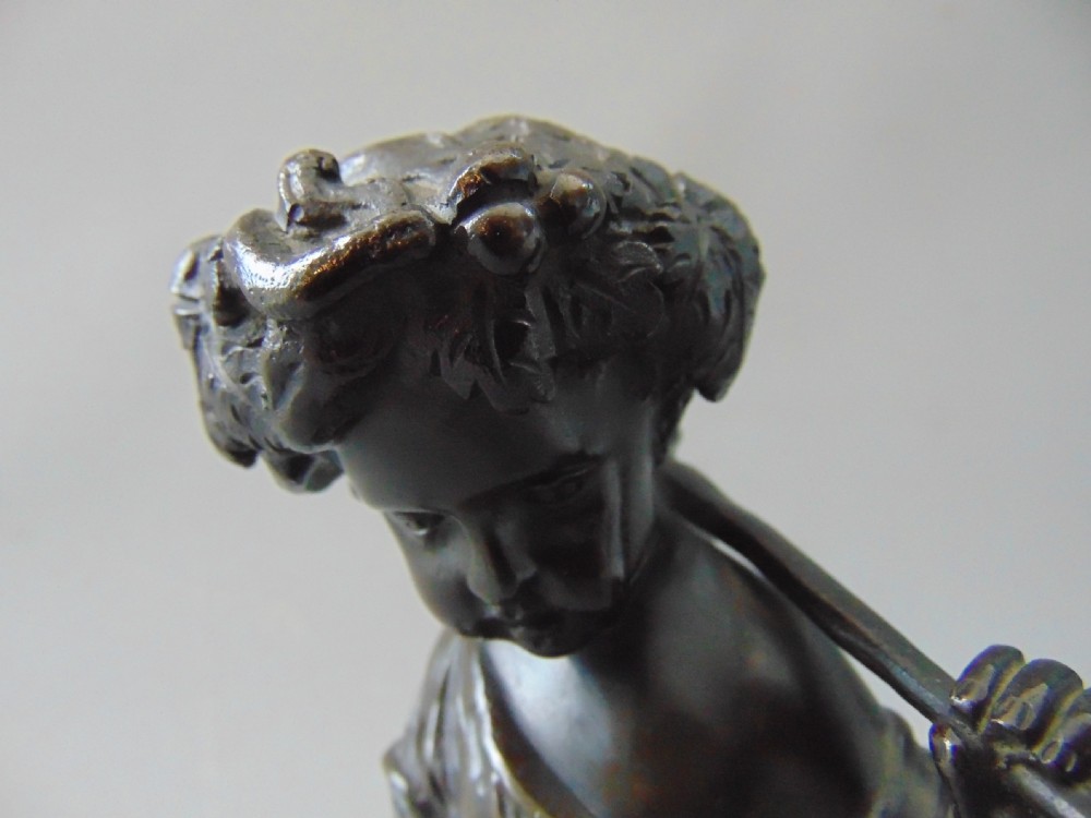 A pair of bronze cherubs  View V