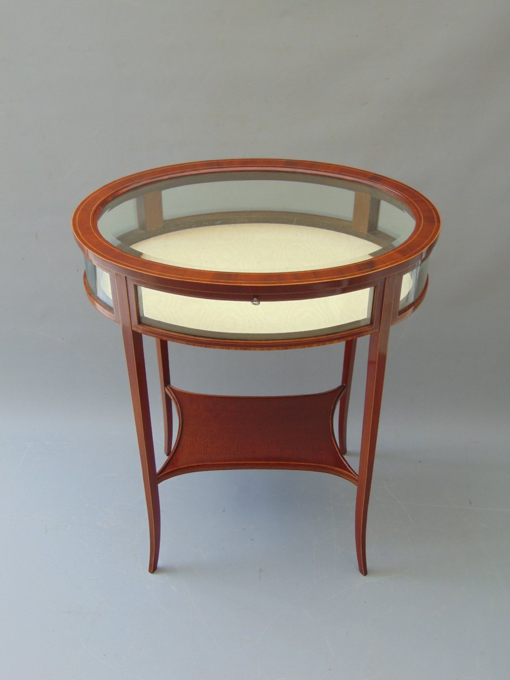 A MAGOGANY OVAL BIJOUTRERIE TABLE 