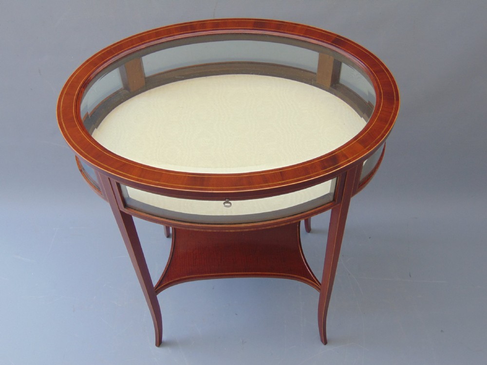 A MAGOGANY OVAL BIJOUTRERIE TABLE  View II